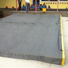 Weighted edge sand pit cover
