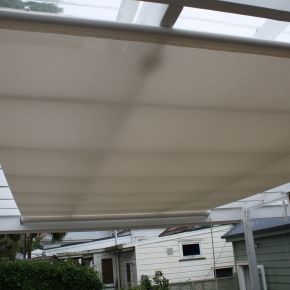 Under roof retractable shade
