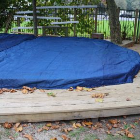 Weighted edge sand pit cover