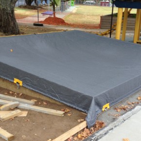 Weighted edge sand pit cover